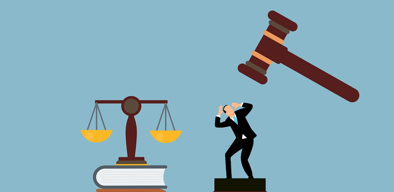 Graphics of a man with a wooden gavel on top of him and book with a Scales of Justice placed on top.