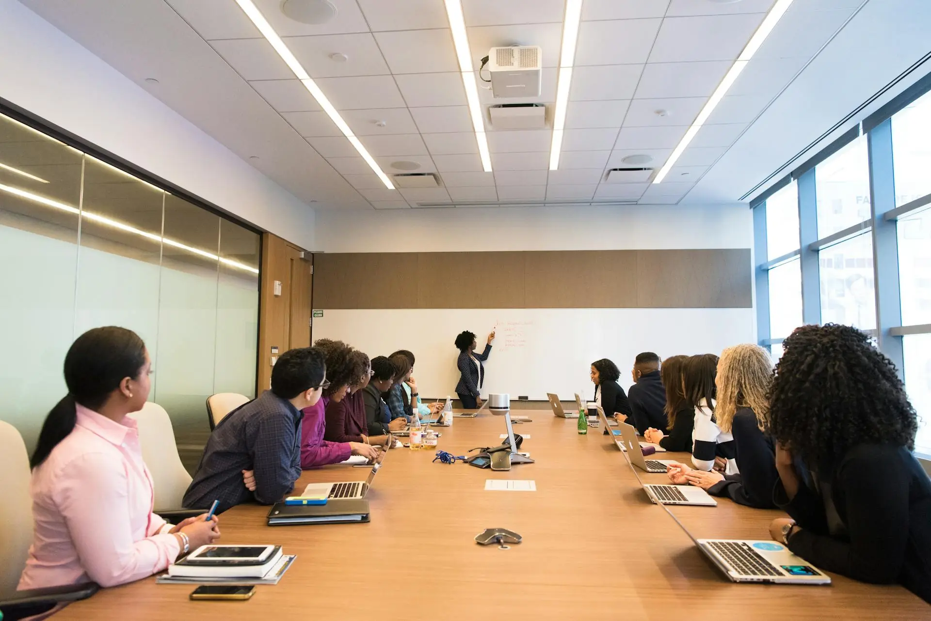 A group of people in a conference room.