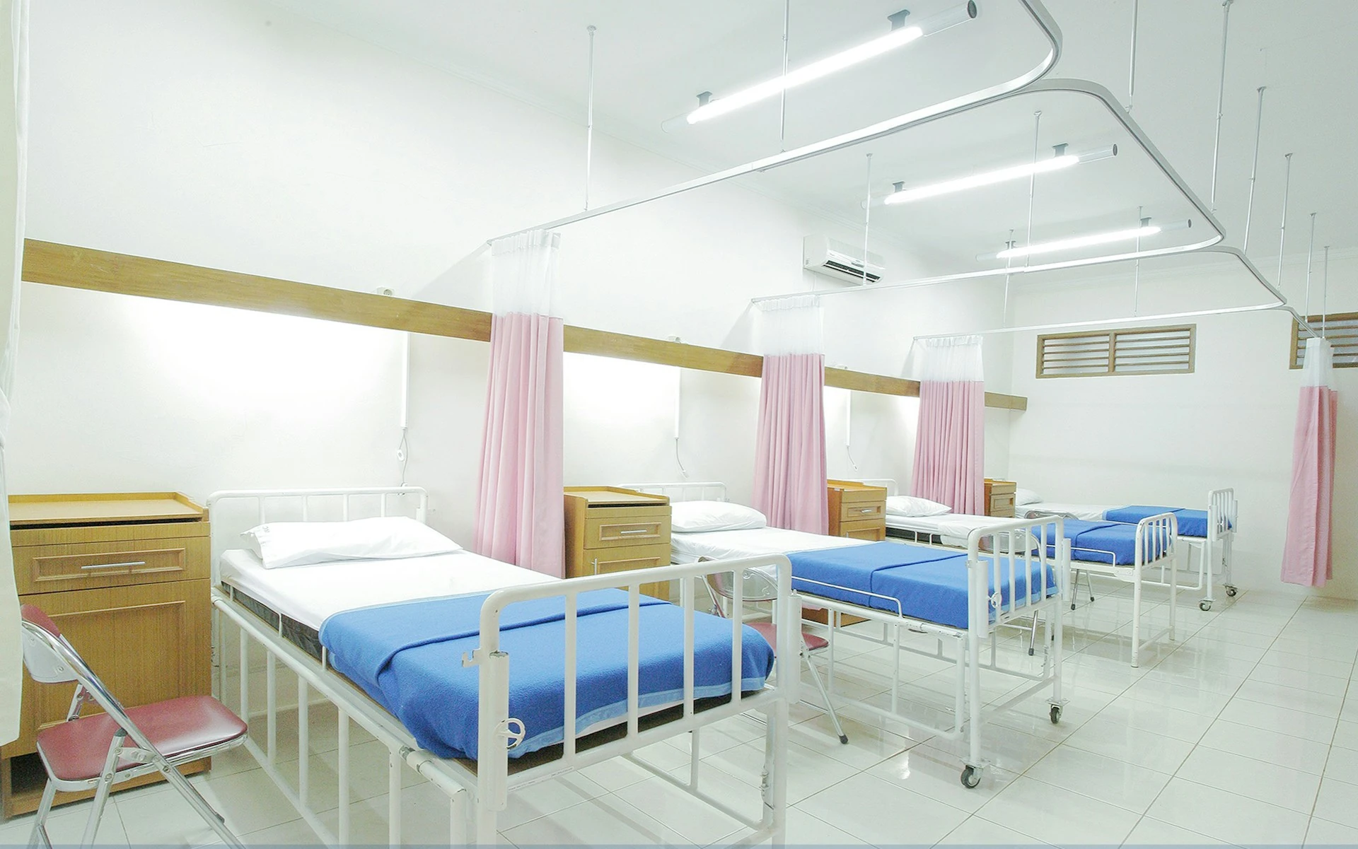 Hospital beds in a shared room.
