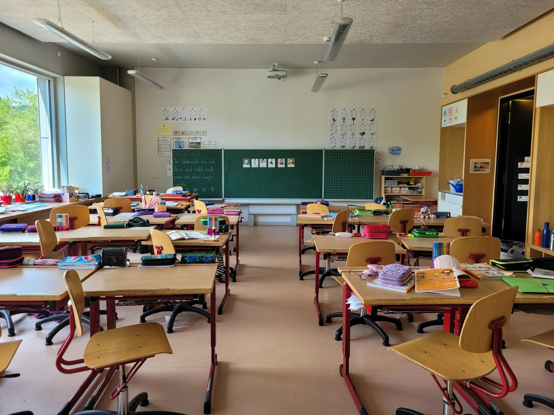 Employee classroom with wooden tables and chairs.