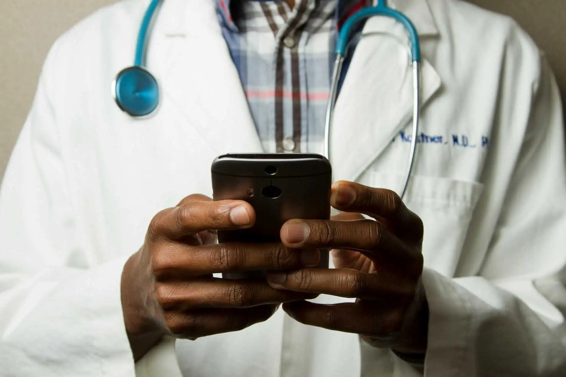 Doctor tracking time in US healthcare.