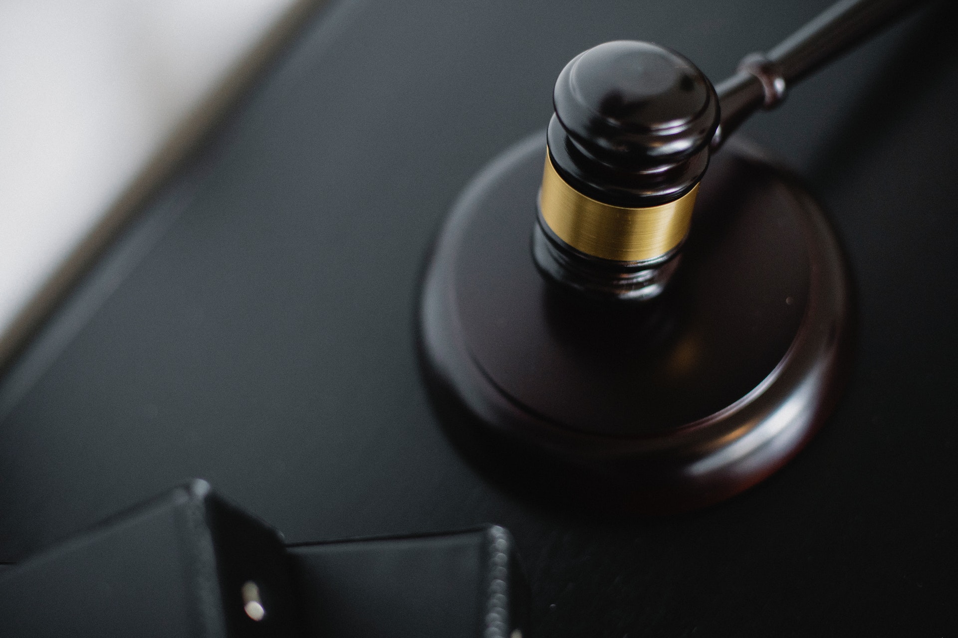 A black gavel and block. Photo by Sora Shimazaki