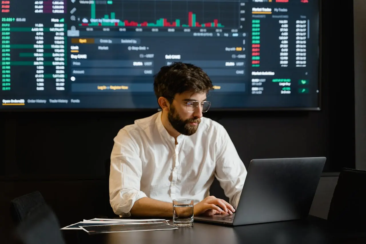 Man analyzing data on a laptop.