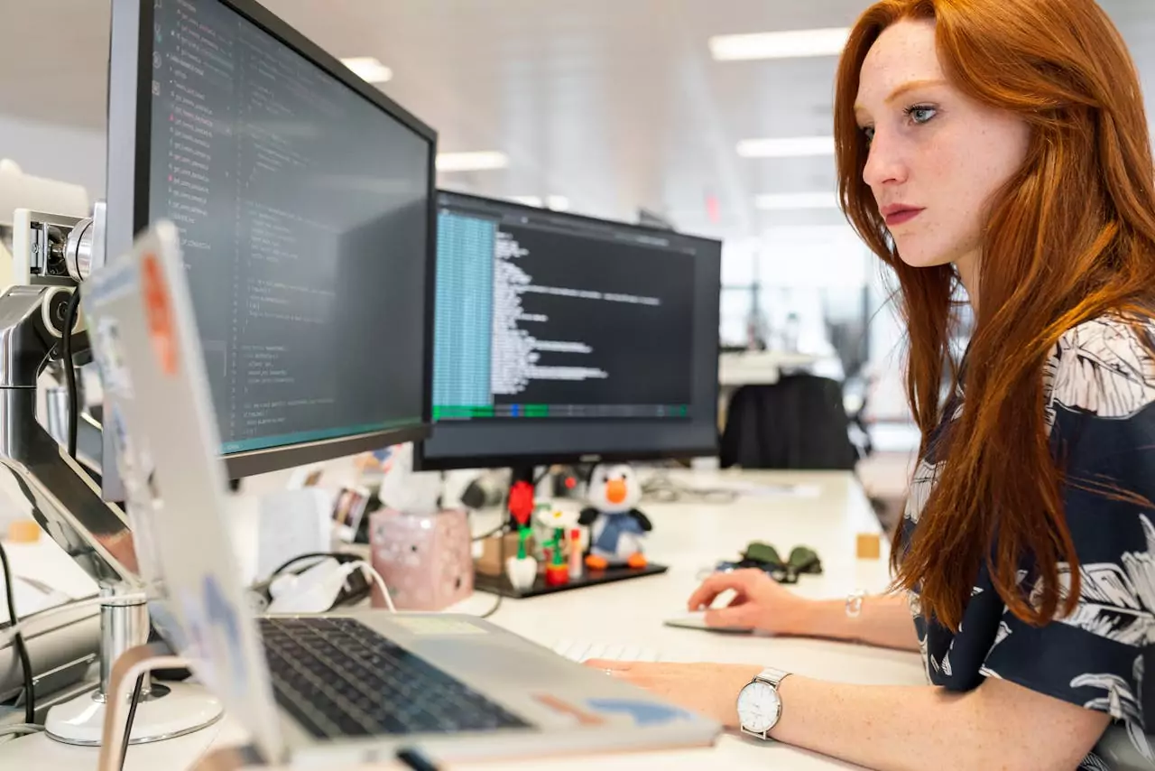 A women busy working on her desk using a consultant management system.