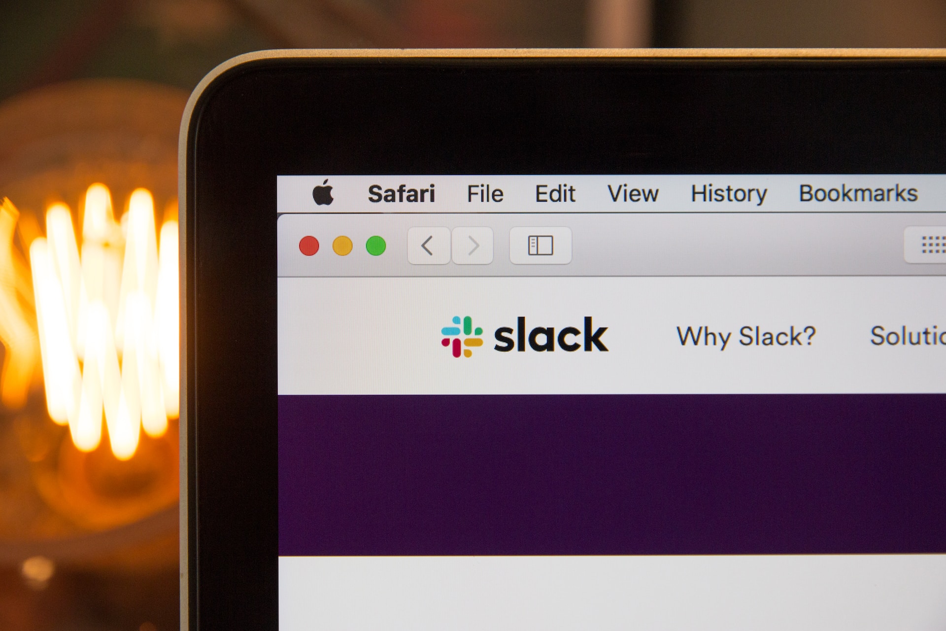 The Slack app displayed on an open MacBook