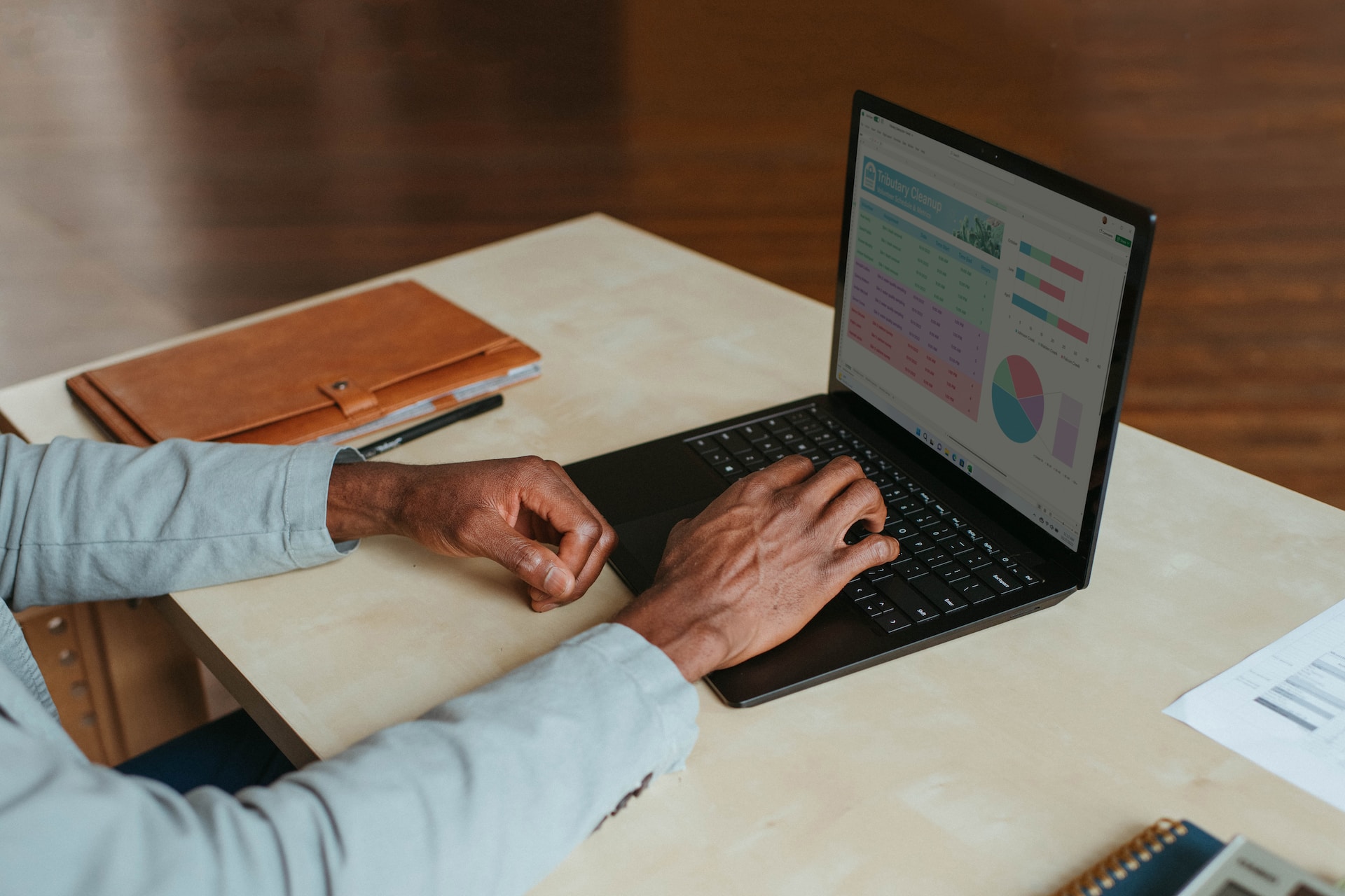 A person working remotely on their laptop. Photo by Windows on Unsplash