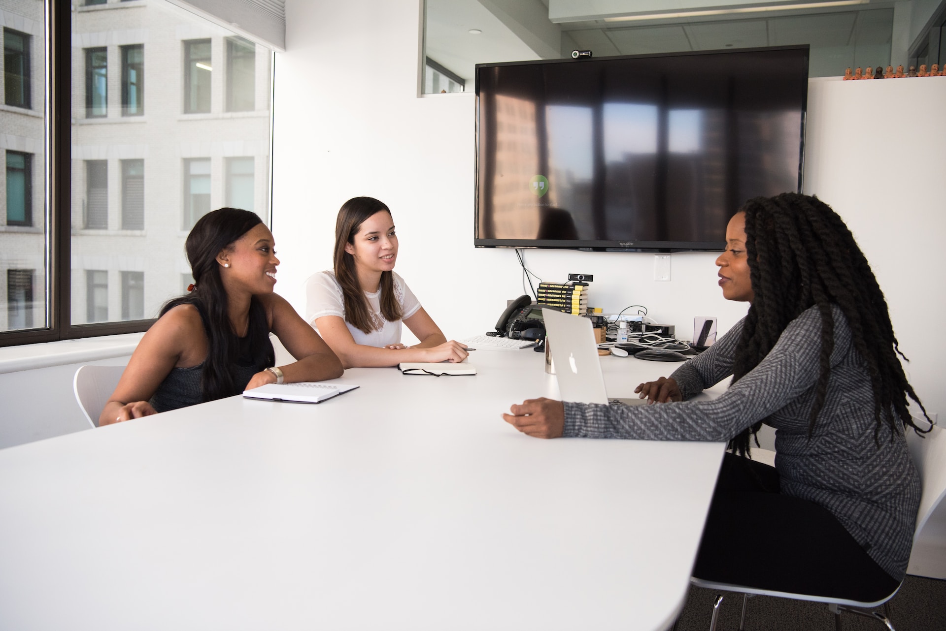 Two women being interviewed in the office. Photo by Christina @ wocintechchat.com on Unsplash