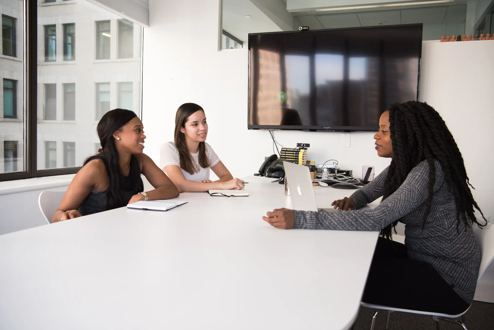 Two women being interviewed in the office. Photo by Christina @ wocintechchat.com on Unsplash