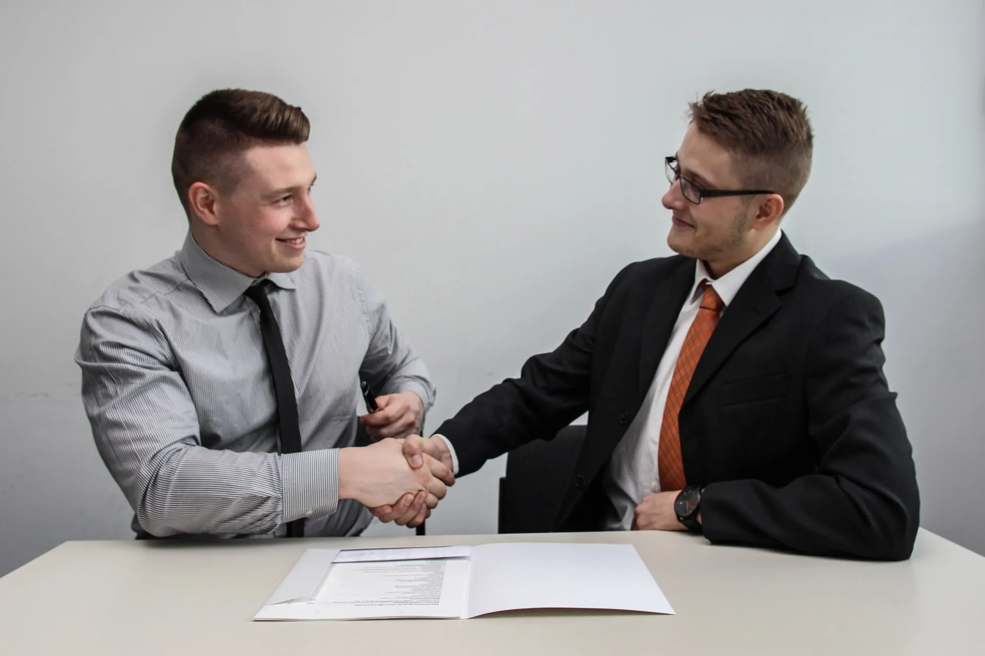 Two men shaking hands to agree on a job offer.Photo by Sebastian Herrmann on Unsplash