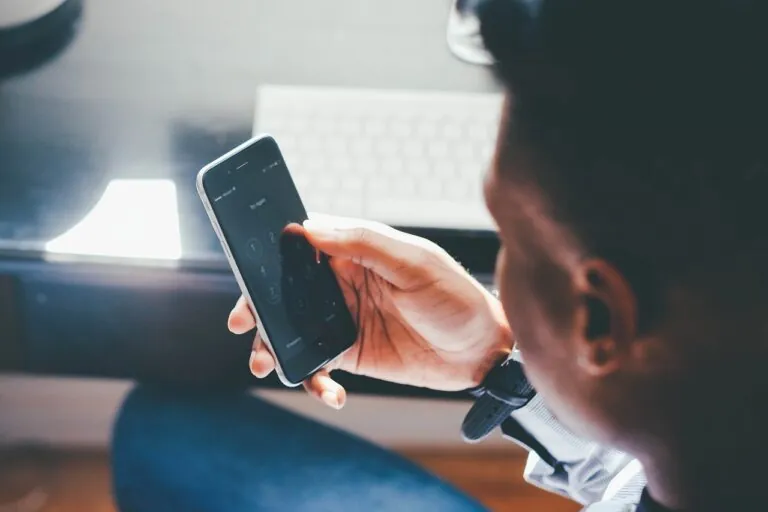 Person looking at phone unlocking it