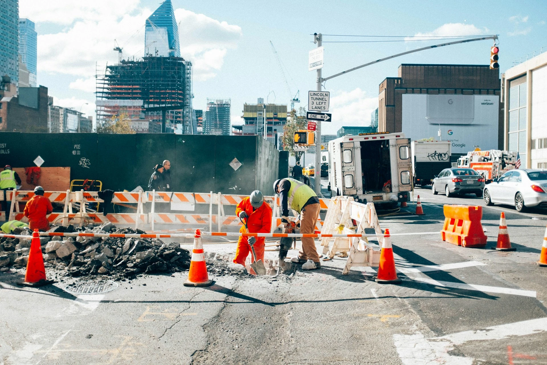 Construction workers fixing a street.