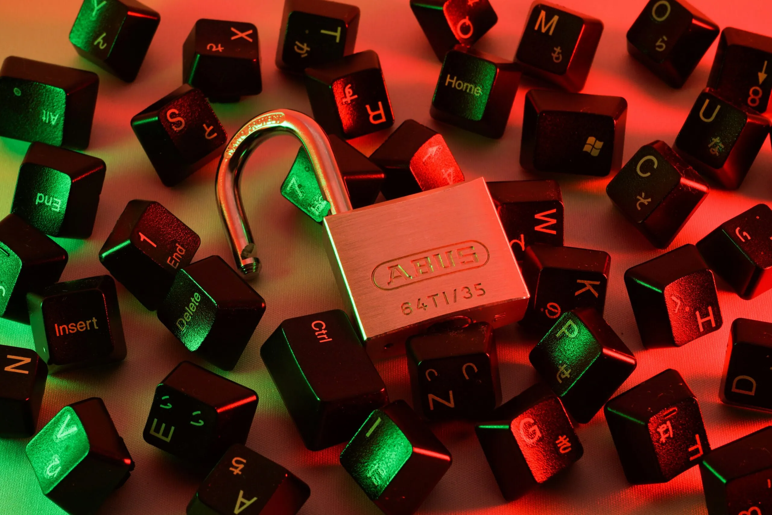 padlock and computer keys representing cyber data leak