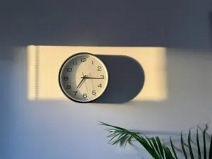 Wall clock with daylight shining on it