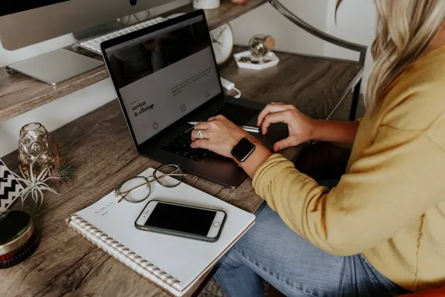 An employee working on their laptop