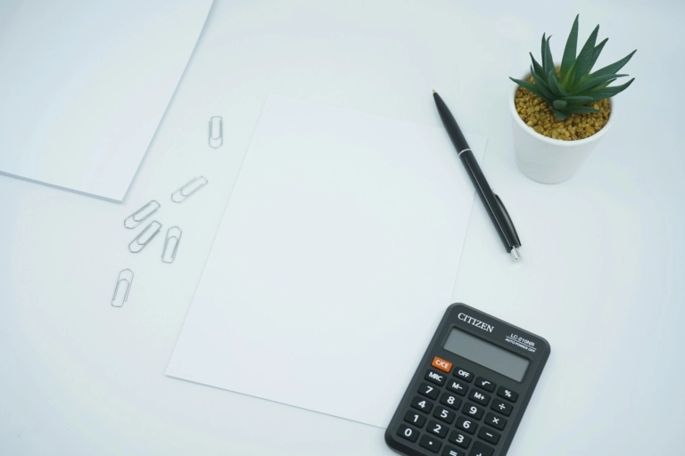 Calculator and a pen and paper