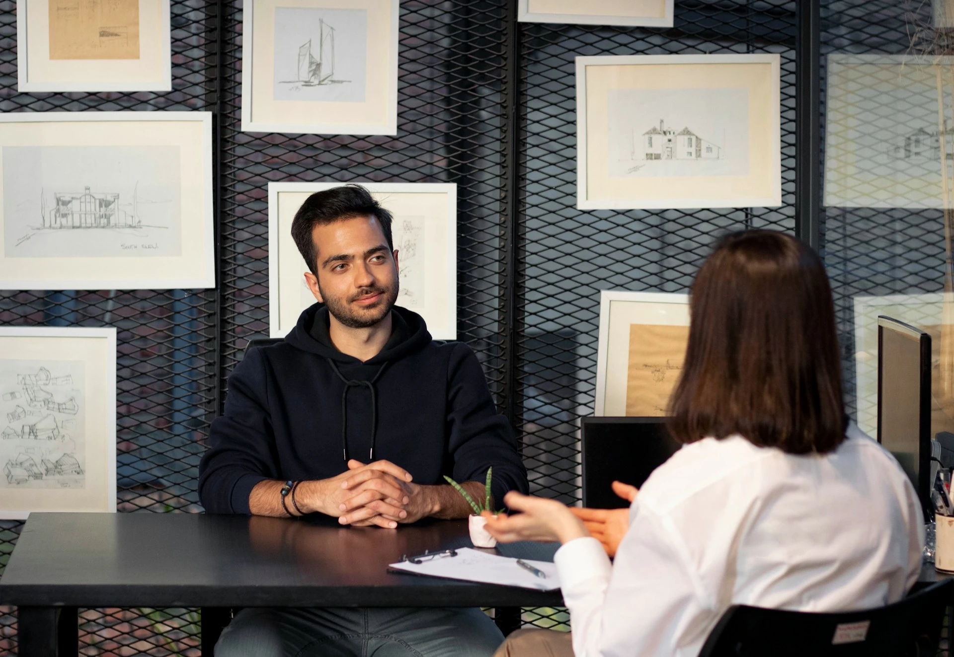 A man interviewing a job candidate in the office.